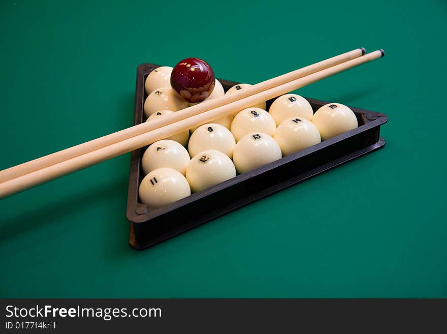 Billiard set on green table close-up image