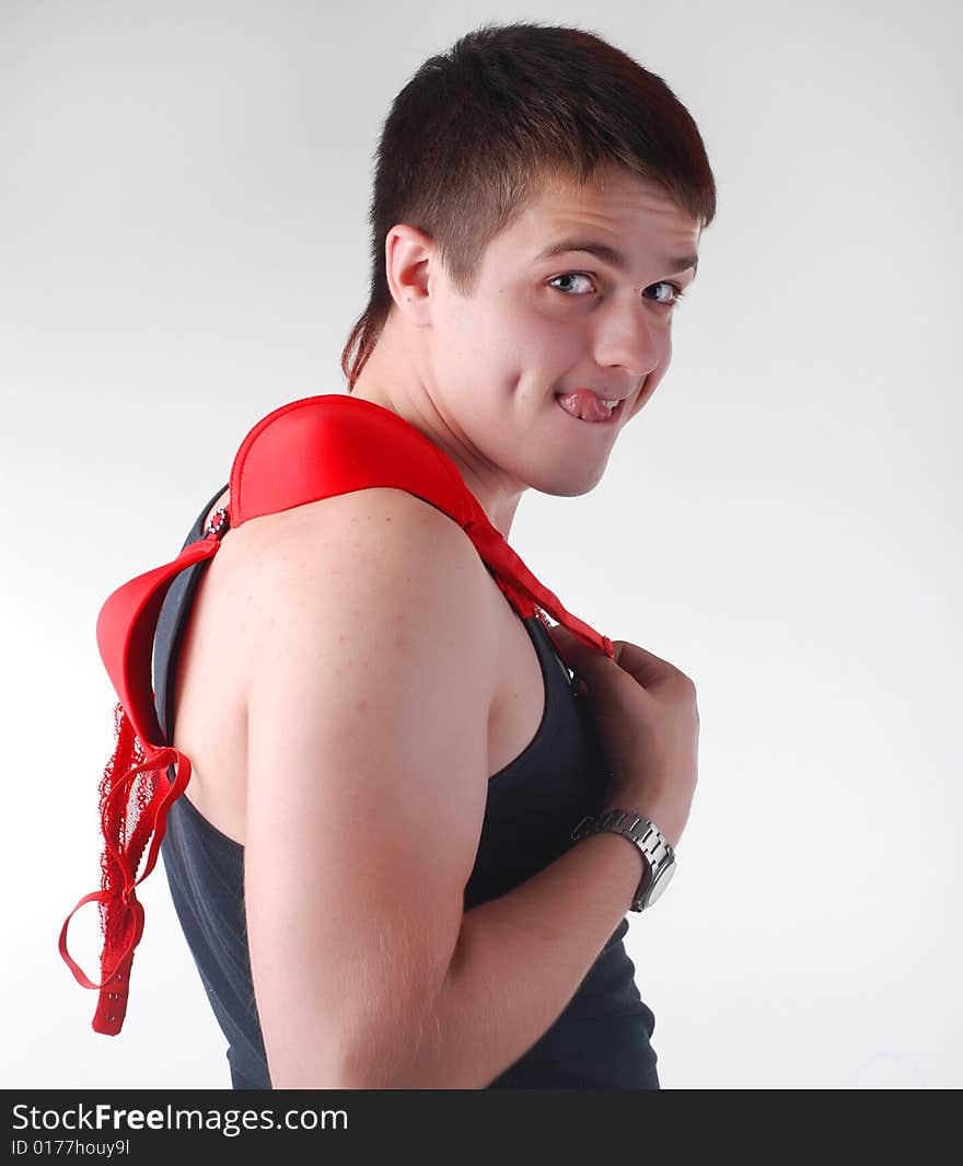 Portrait of attractive fun man with red bra. Portrait of attractive fun man with red bra