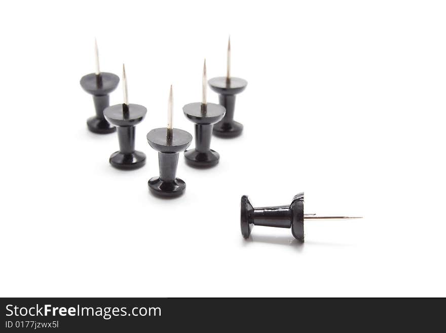 Isolated group of black drawing-pins