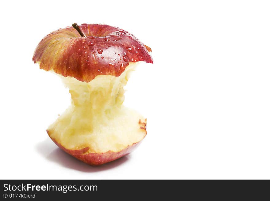 Isolated red apple stumb with drops