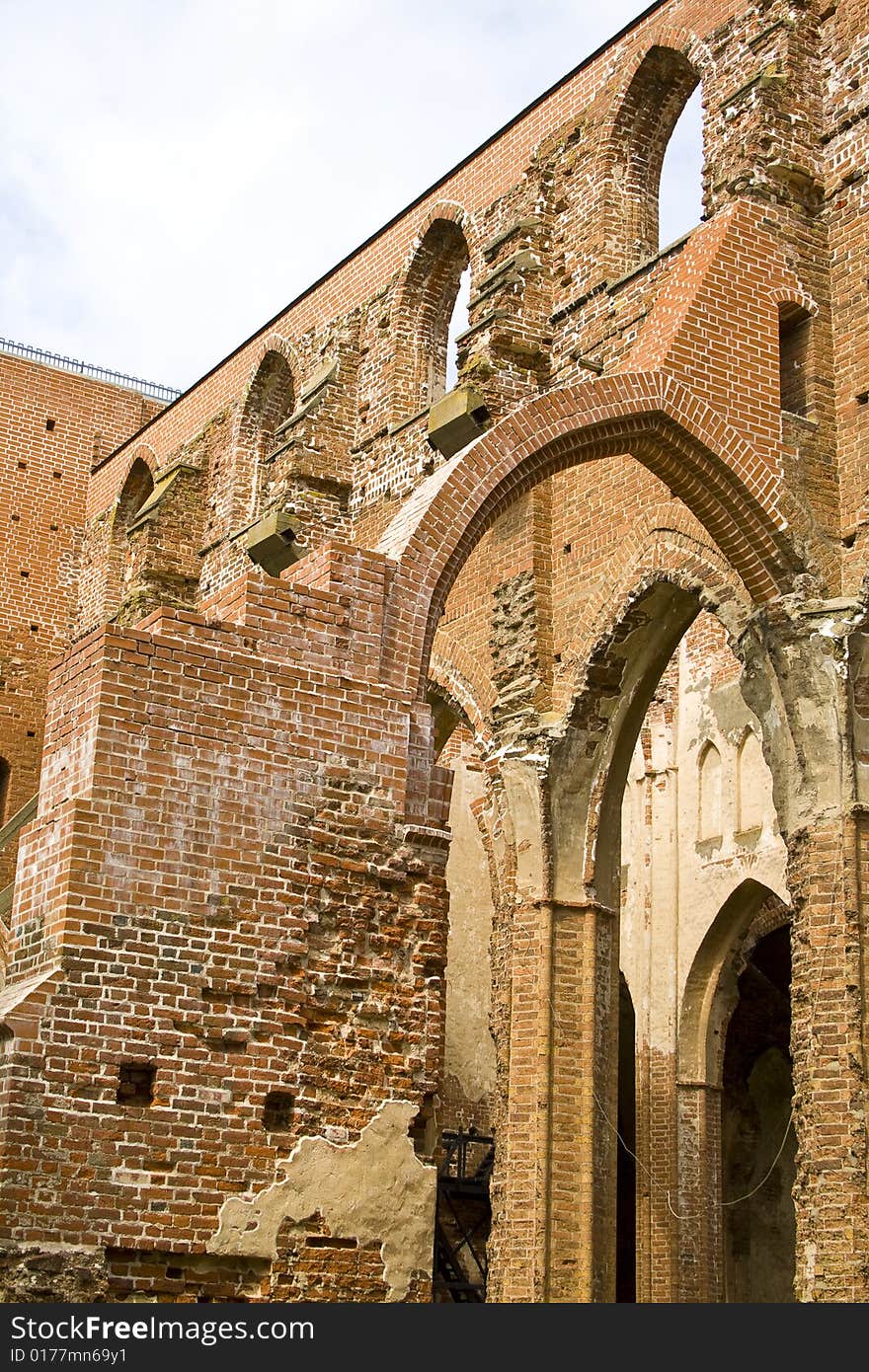 Ruined medieval castle in Latvia on a background of the blue sky