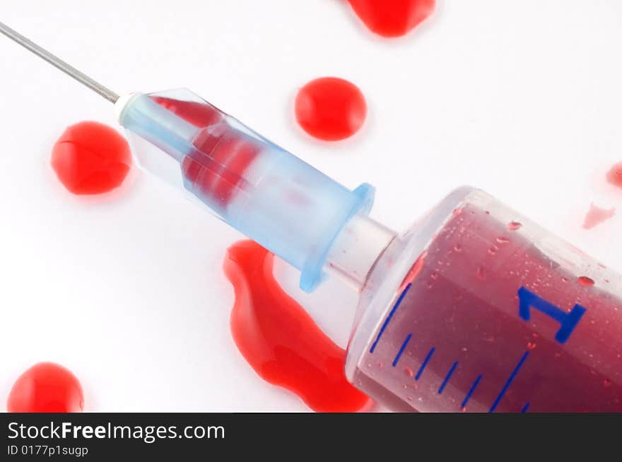 Syringe And Blood Drops