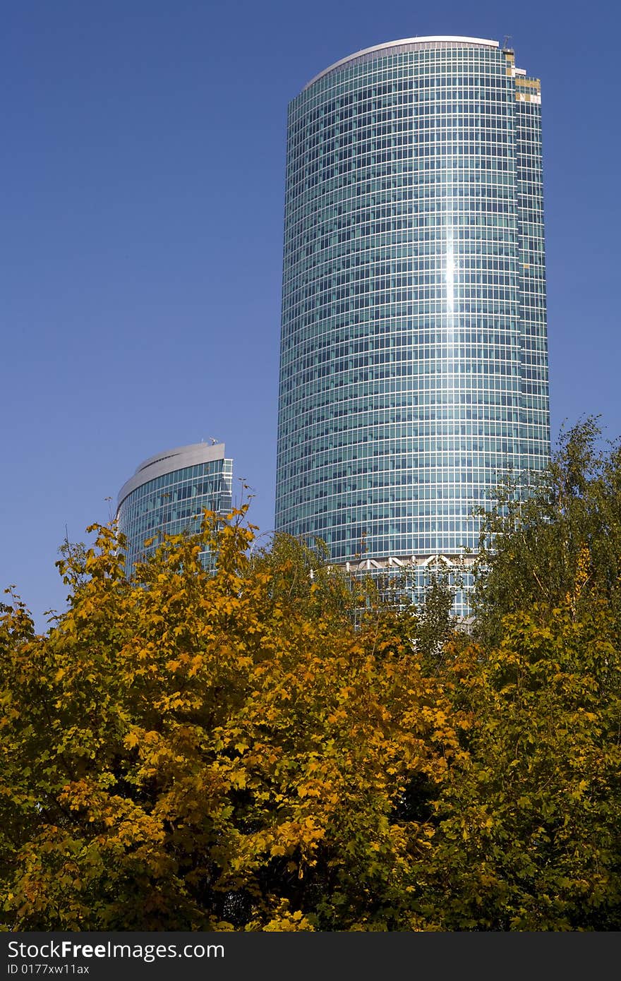 Two modern skyscrapers at autumn sunny day. Two modern skyscrapers at autumn sunny day