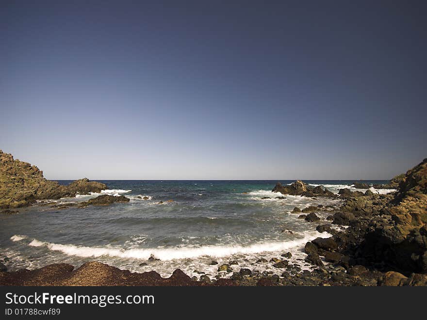 Mediterranean Rocky Beach.
Where the waves crash against the rock cliff