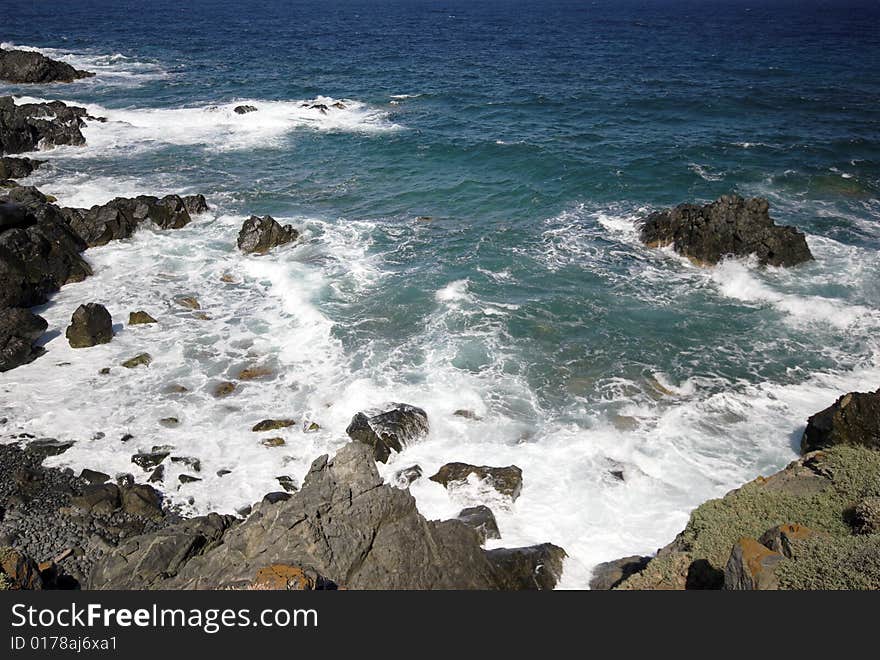 Seascape.
Where the waves crash against the rock cliff