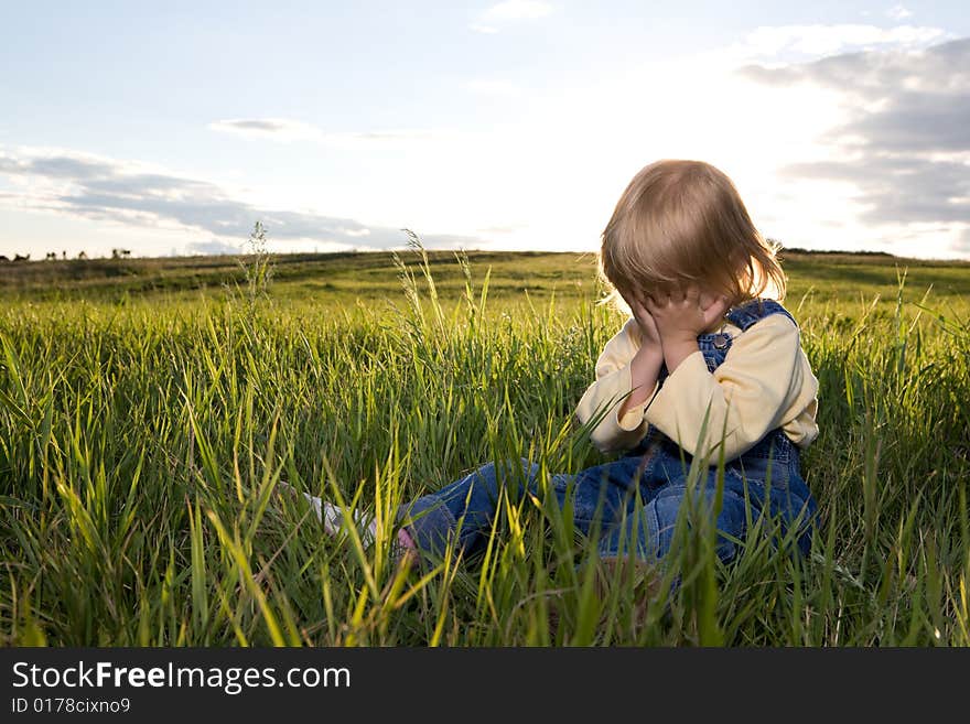 Little Girl Sit In Grass