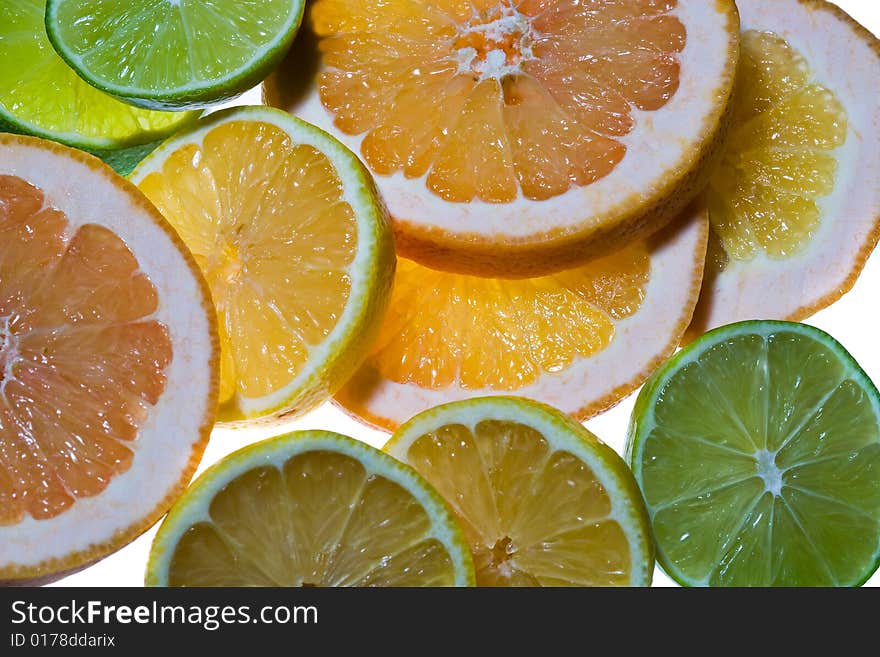 Miscellaneous citrus fruits sliced closeup. Miscellaneous citrus fruits sliced closeup