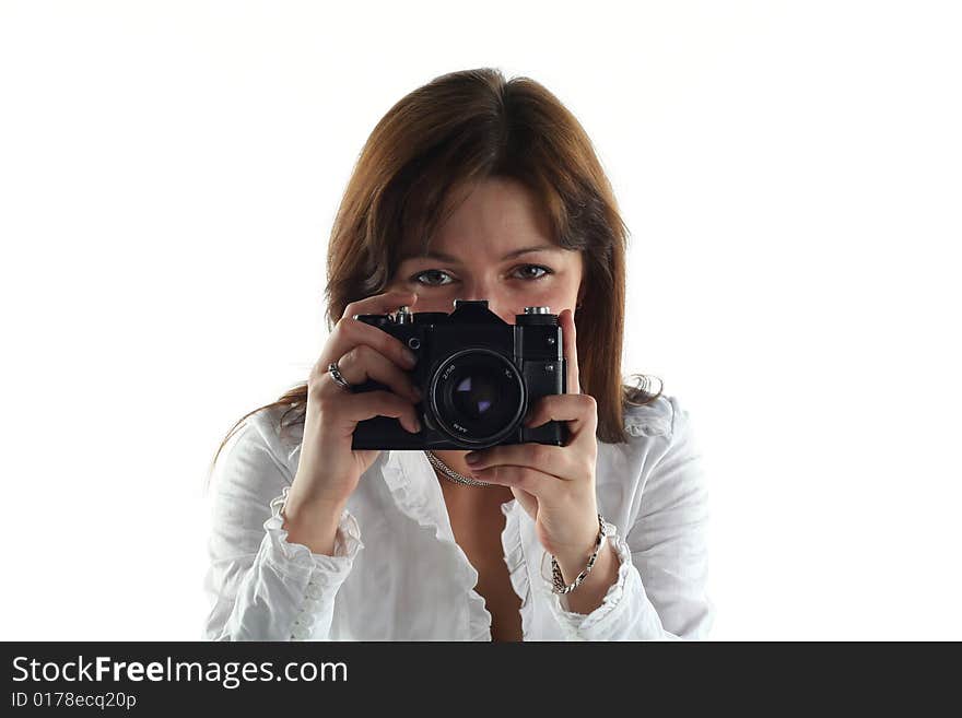 Young woman with old camera isolated on white background