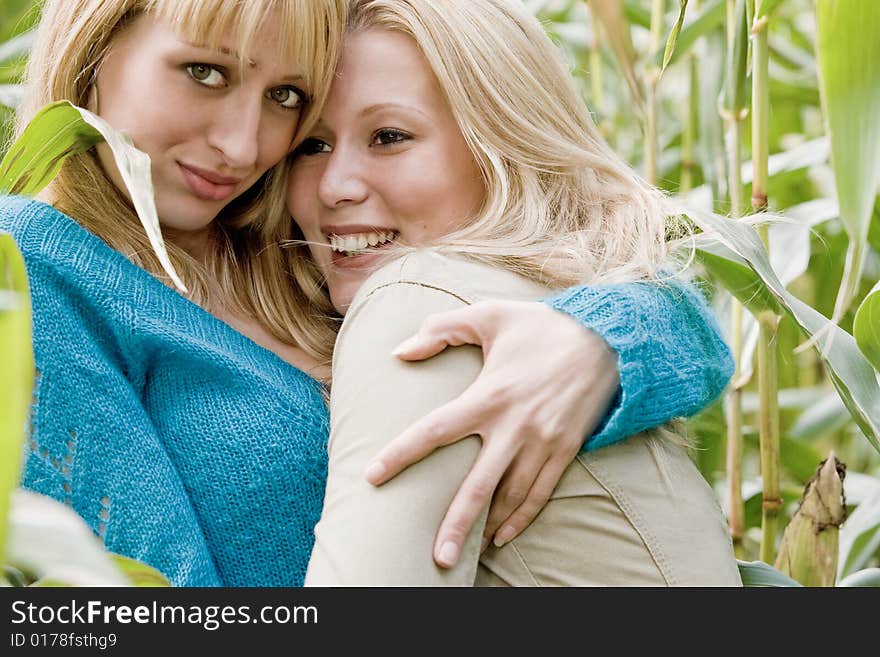 Two sisters in a park having fun. Two sisters in a park having fun