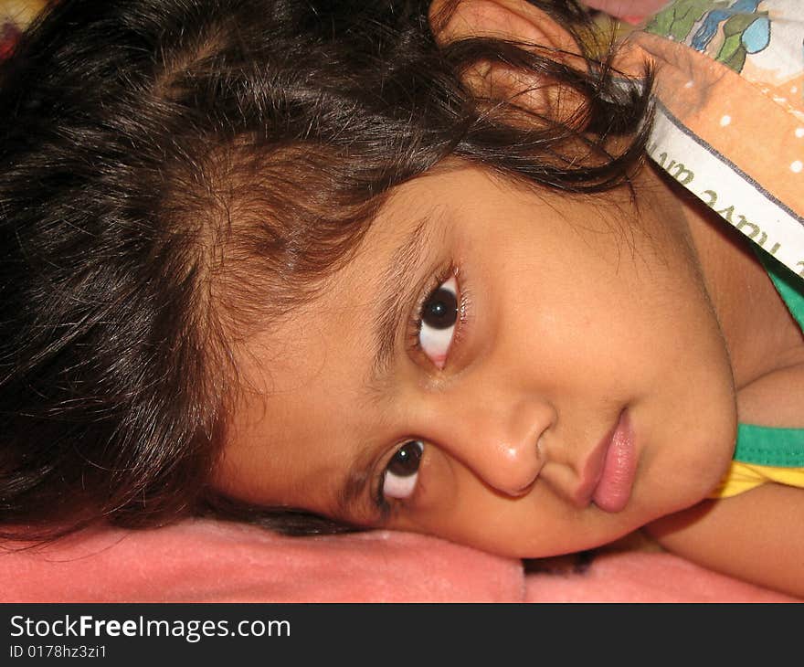 Sleepy Little Girl lying on the bed. Sleepy Little Girl lying on the bed