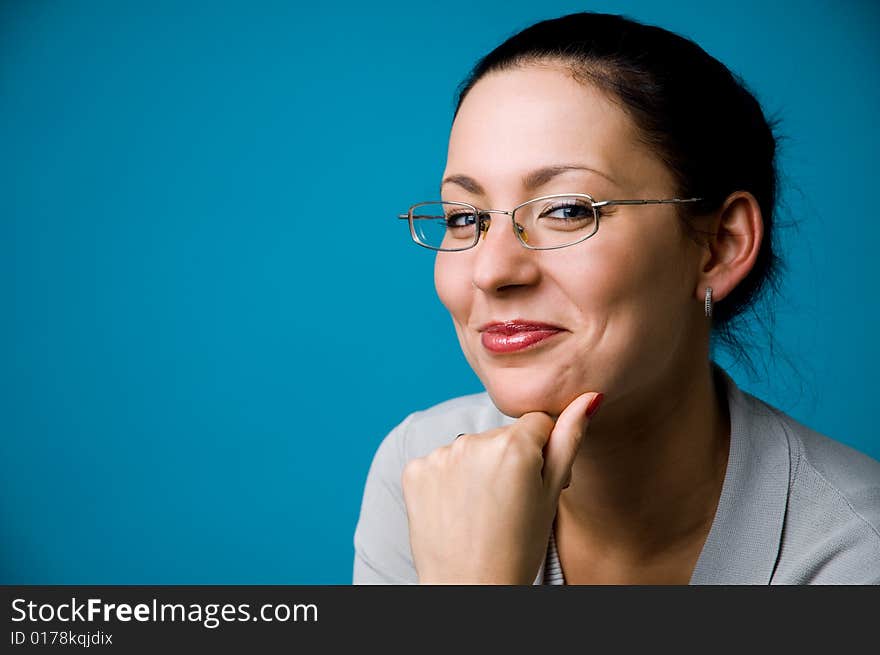 The woman in points on a dark blue background