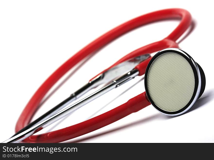 Red stethoscope isolated in white background