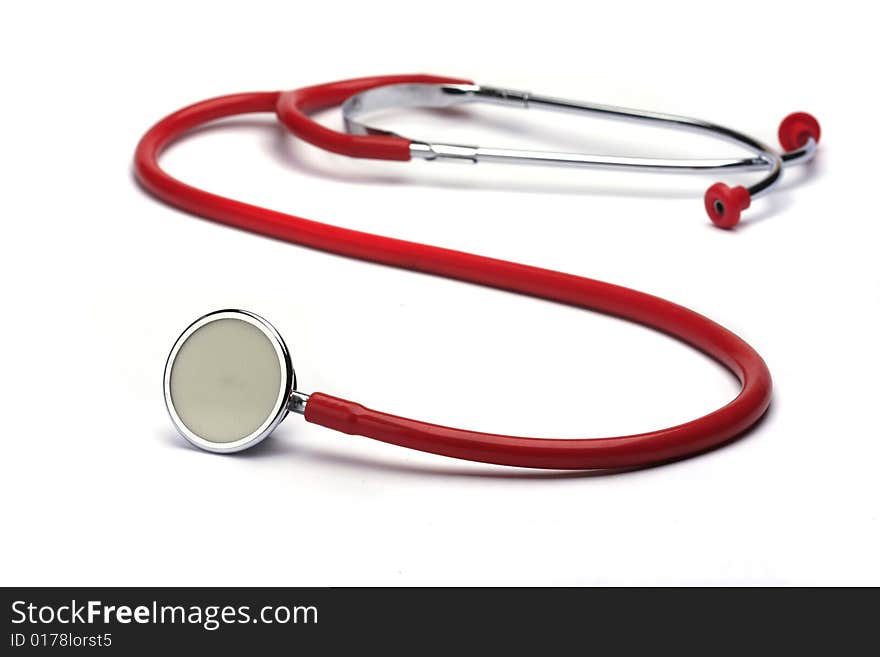 Red stethoscope isolated in white background