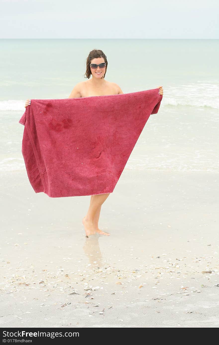 Bare Brunette At The Beach Vertical