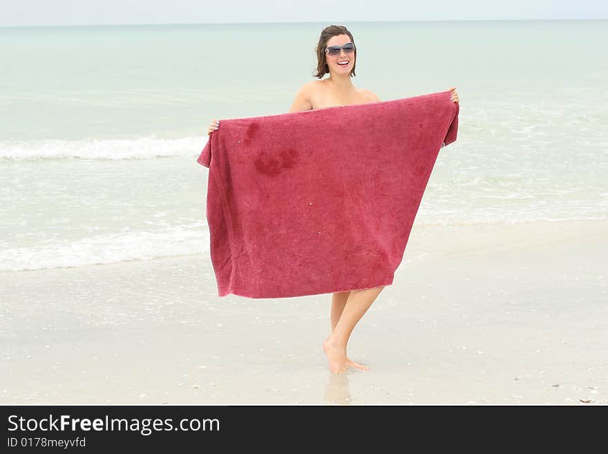 Bare Brunette At The Beach