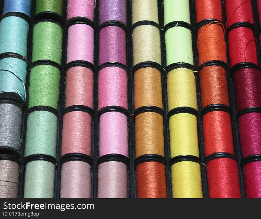 A group of assorted colored cotton rolls