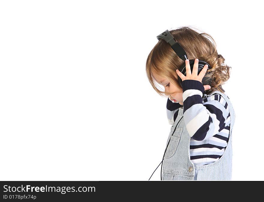 Beauty a little girl listening music on white background