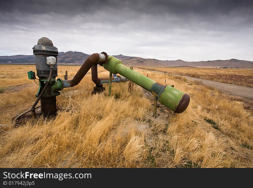 Abandoned irrigation pipes, in field of dried up vegetation. Abandoned irrigation pipes, in field of dried up vegetation