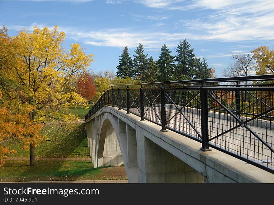 Bridge leading into autumn woods