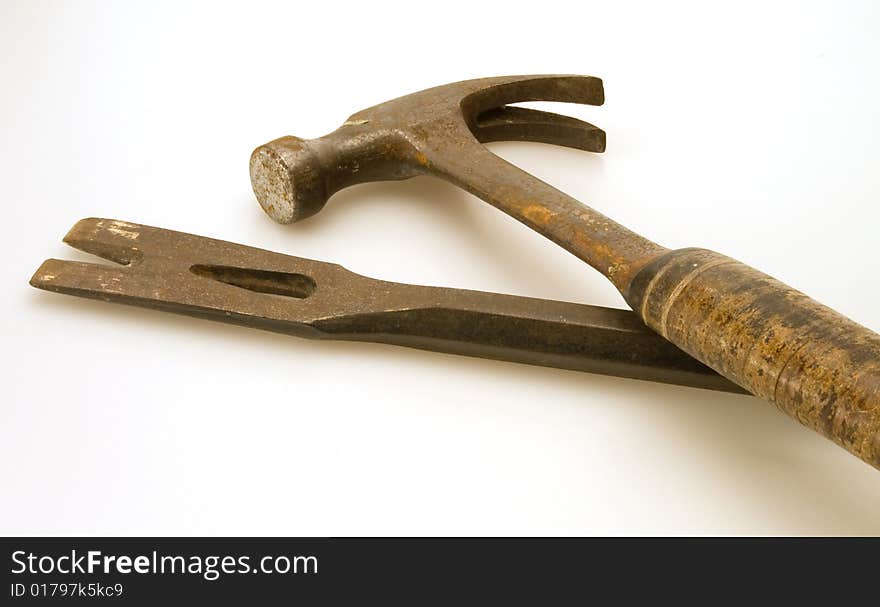 Old steel hammer and worn flat prybar. Old steel hammer and worn flat prybar