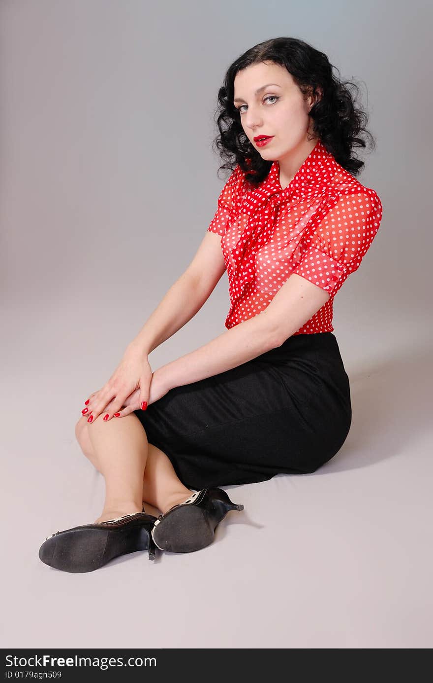 Retro pin-up girl in red blouse