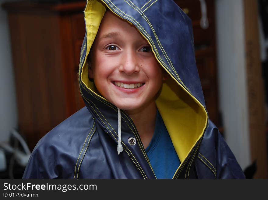 Boy ready to play  spring rain