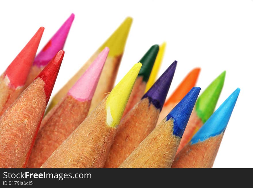 Close up of color pencils with different color over white background.