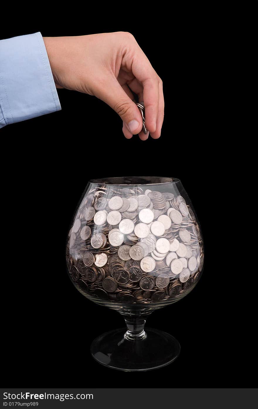 Man's hand puts money into the glass. Man's hand puts money into the glass