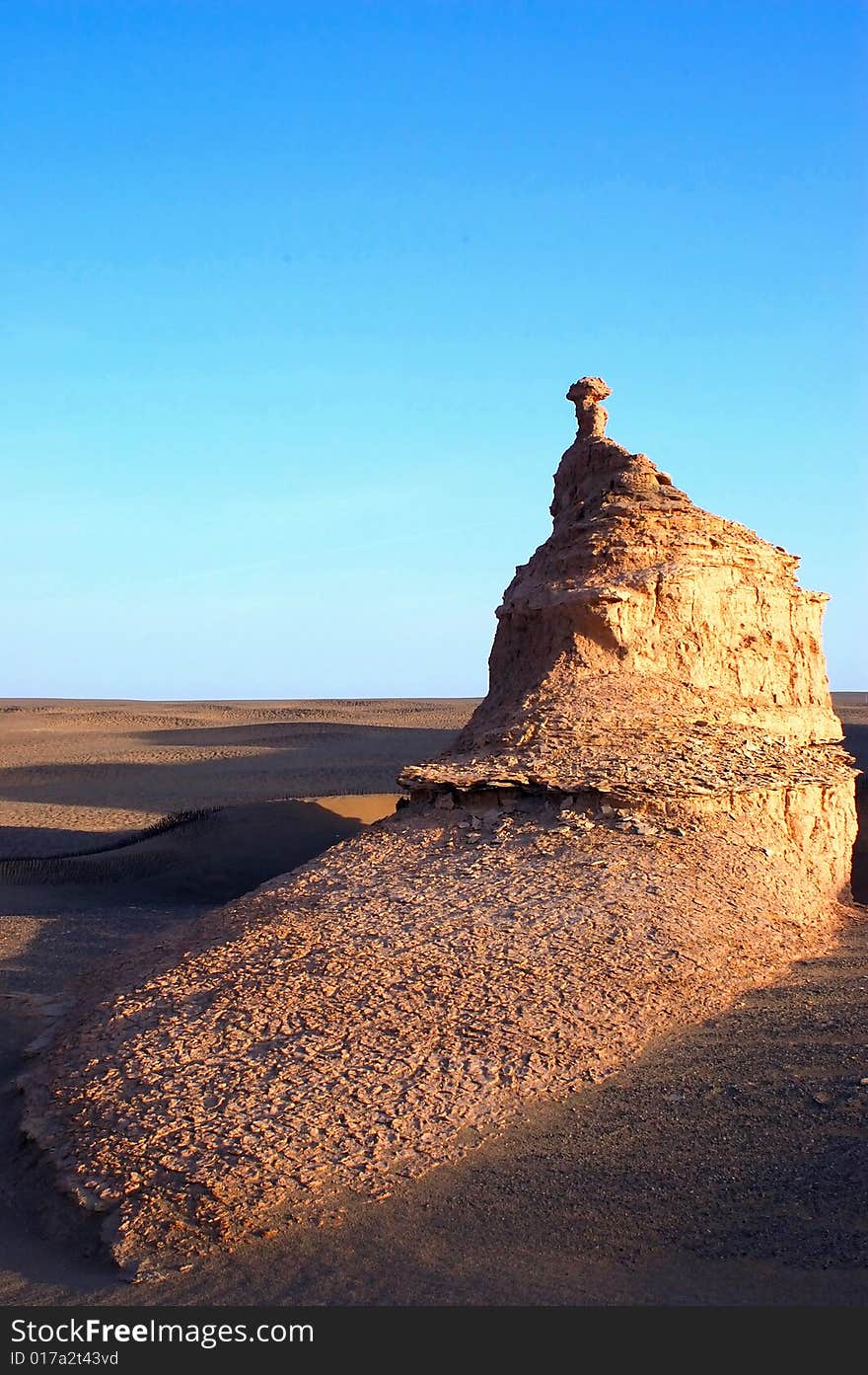 Yardang landform in northwest China A yardang is formed in cohesive material. Yardangs can be found in most deserts across the globe. Depending upon the winds and the composition of the weakly indurated deposits of silt and sand from which they are carved, yardangs may form very unusual shapes â€” some resemble various objects or even people.