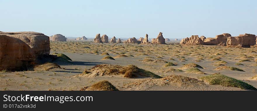 A yardang is formed in cohesive material. Yardangs can be found in most deserts across the globe. Depending upon the winds and the composition of the weakly indurated deposits of silt and sand from which they are carved, yardangs may form very unusual shapes — some resemble various objects or even people. A yardang is formed in cohesive material. Yardangs can be found in most deserts across the globe. Depending upon the winds and the composition of the weakly indurated deposits of silt and sand from which they are carved, yardangs may form very unusual shapes — some resemble various objects or even people.