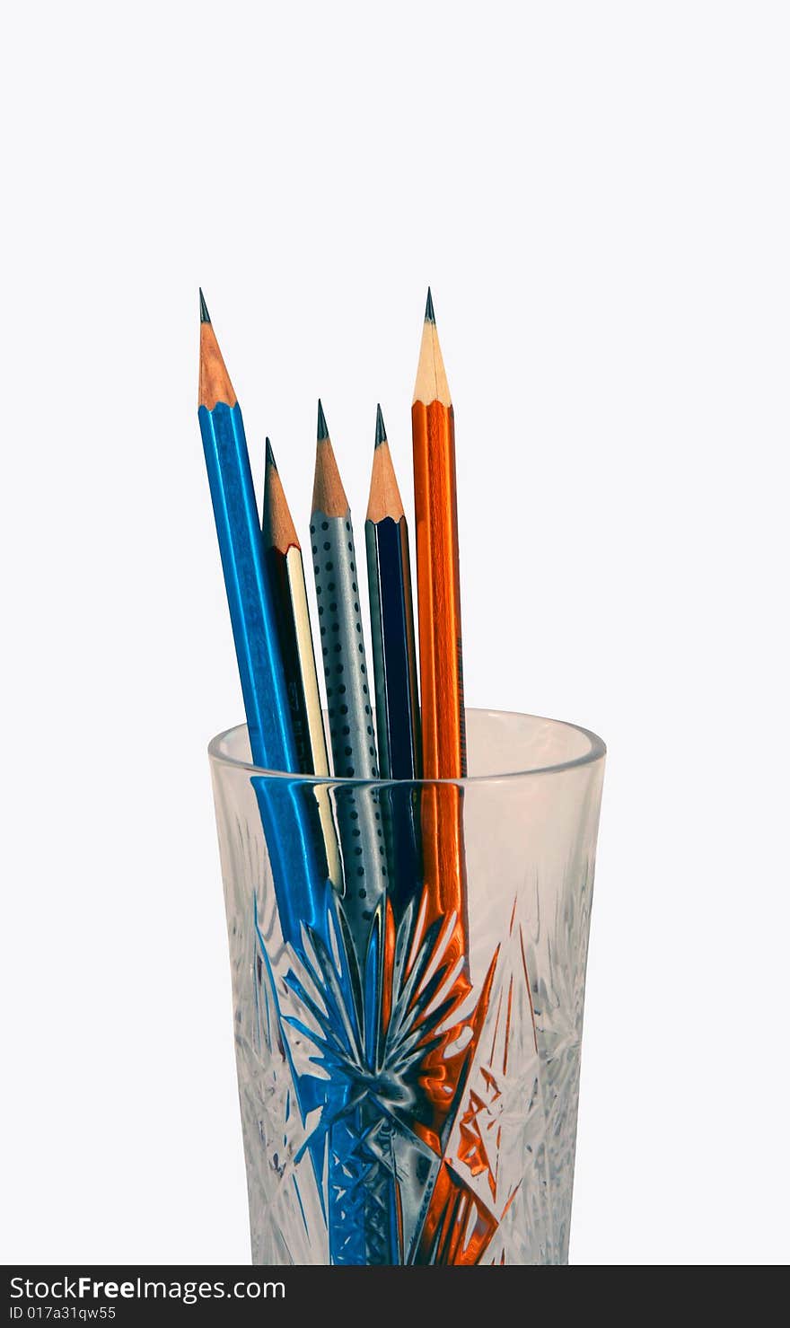 Drawing pencils in a glass on a white background