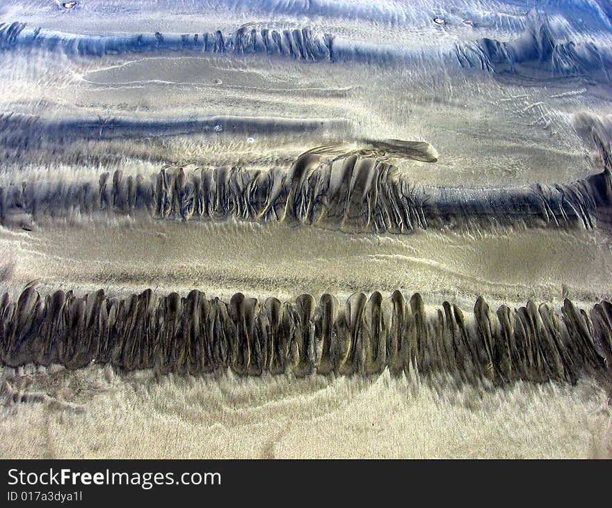 Paths of ocean waves on sand. Bali (Indonesia). Paths of ocean waves on sand. Bali (Indonesia)