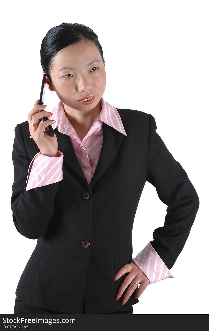 Chinese businesswoman, wearing lady's suit and shirt. Using mobile phone. Chinese businesswoman, wearing lady's suit and shirt. Using mobile phone.