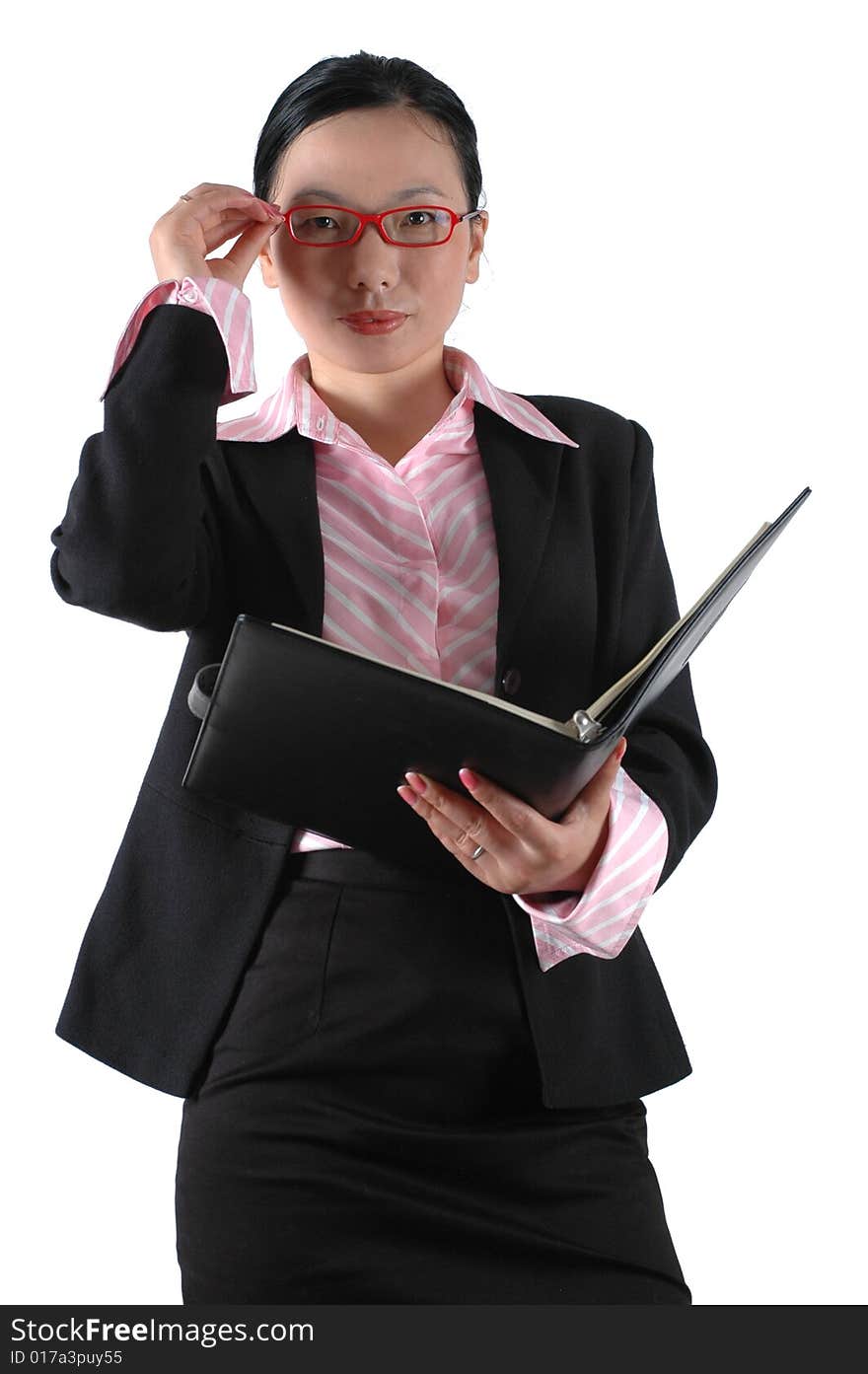 Chinese businesswoman, wearing lady's suit and shirt.  Holding documents. Chinese businesswoman, wearing lady's suit and shirt.  Holding documents.