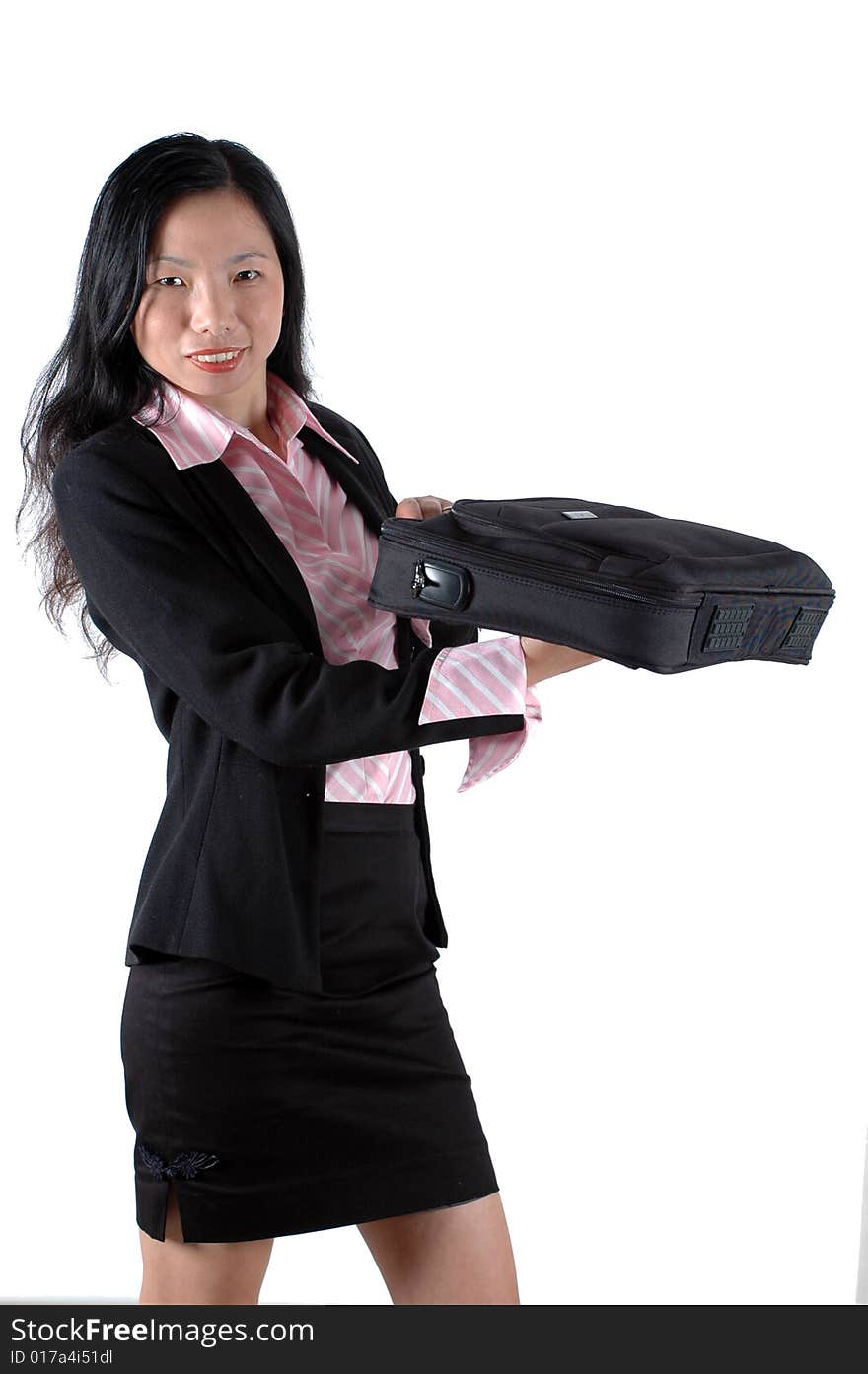 Chinese businesswoman, smiling and holding briefcase, laptop bag, wearing lady's suit and shirt. Chinese businesswoman, smiling and holding briefcase, laptop bag, wearing lady's suit and shirt.