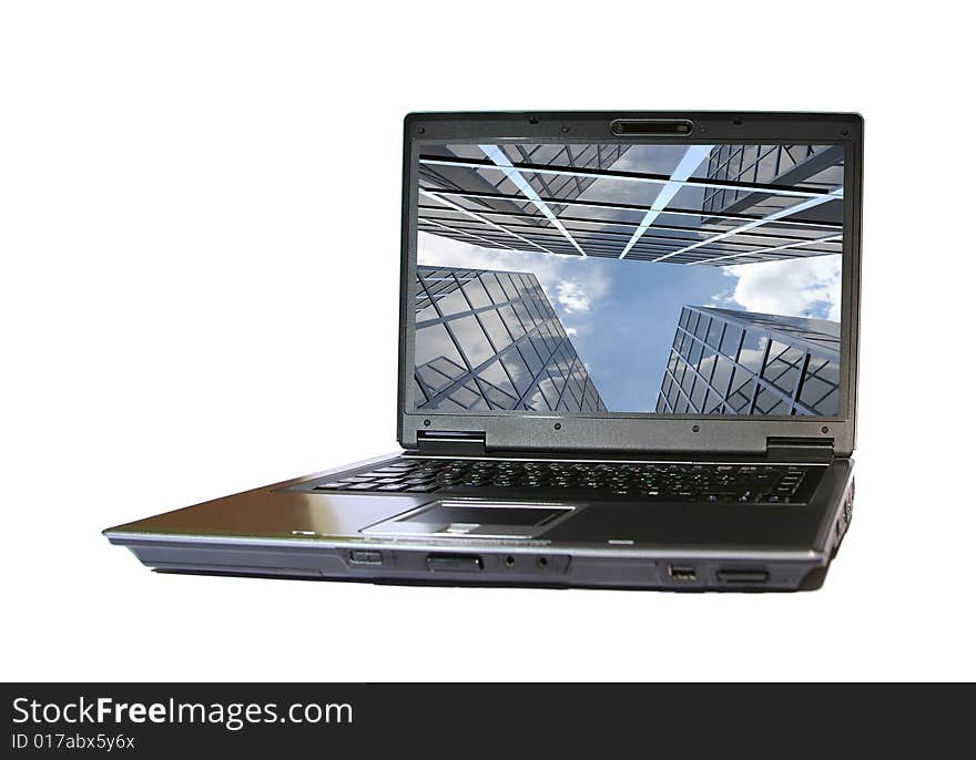 Laptop with modern building on desctop. Laptop with modern building on desctop