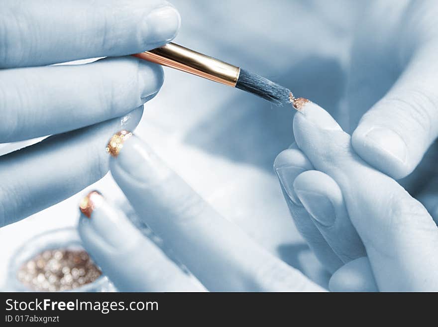 Manicure in a beauty salon on female hands. Manicure in a beauty salon on female hands