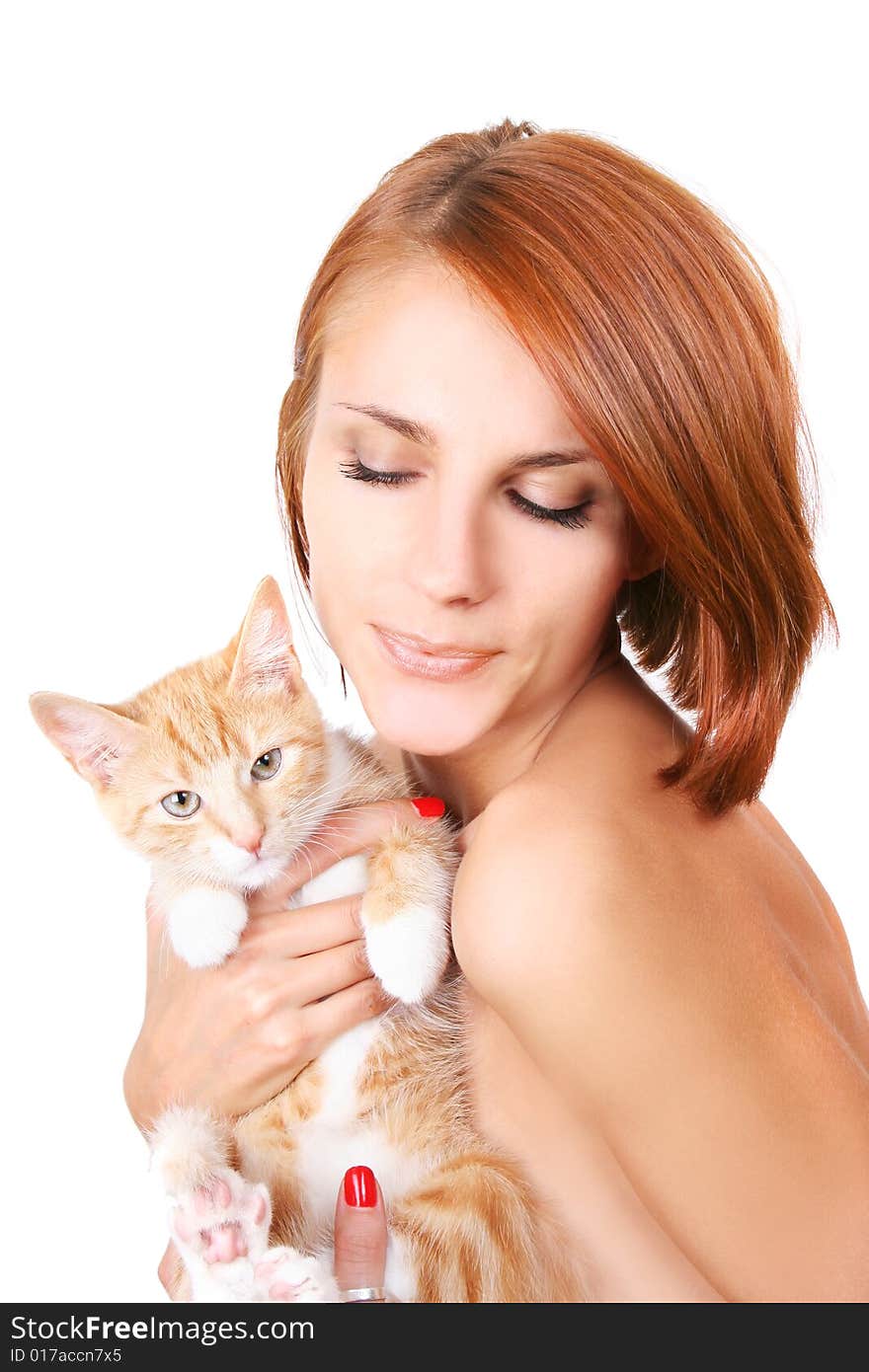 Beautiful redhead girl with red fluffy kitten. Beautiful redhead girl with red fluffy kitten