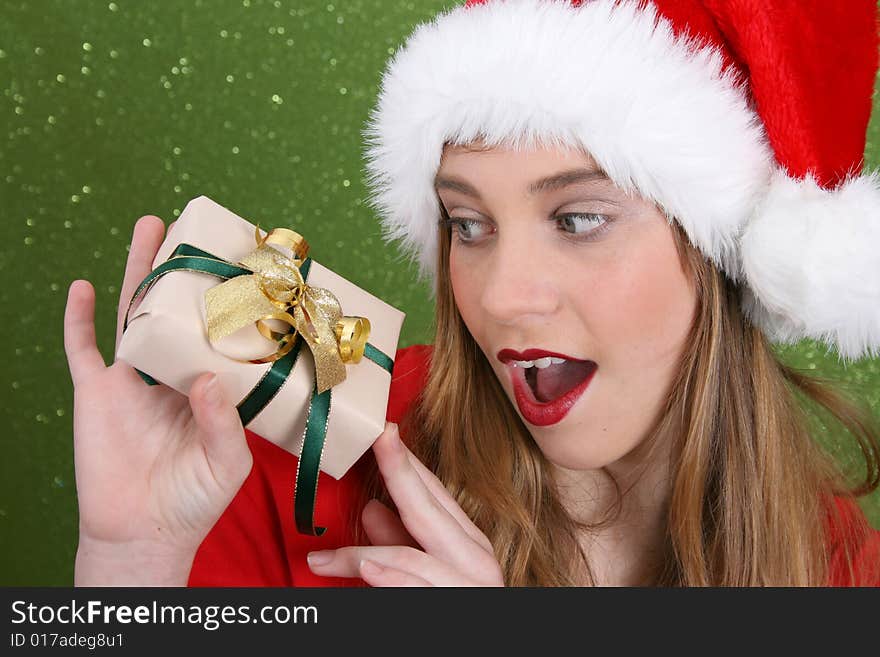 Teenager with red lips wearing a christmas hat. Teenager with red lips wearing a christmas hat