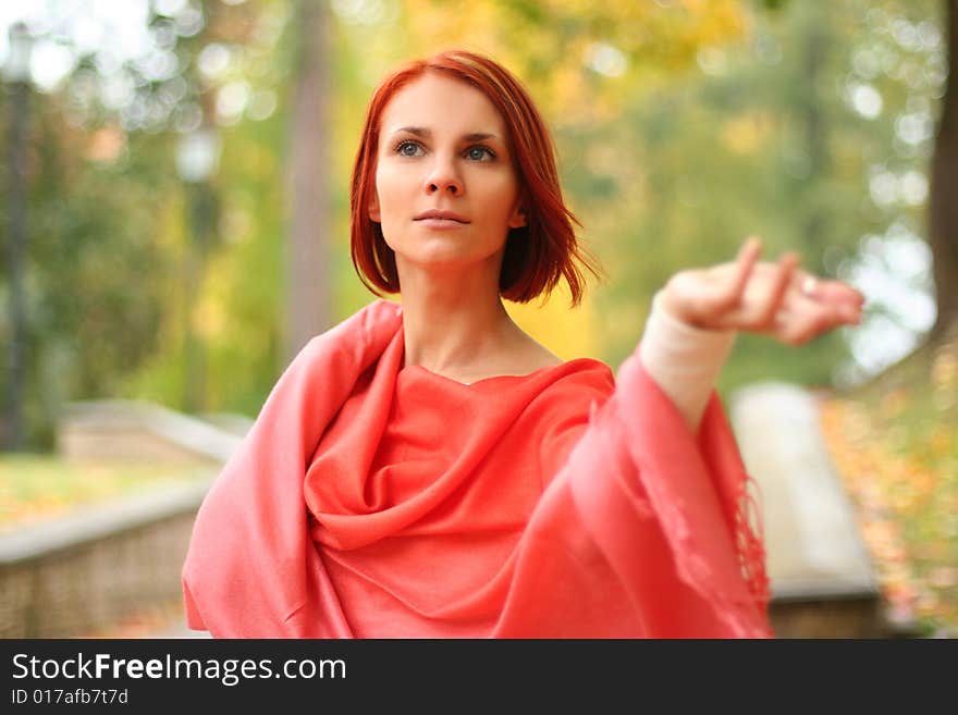 Young girl walking in autumn park. Young girl walking in autumn park