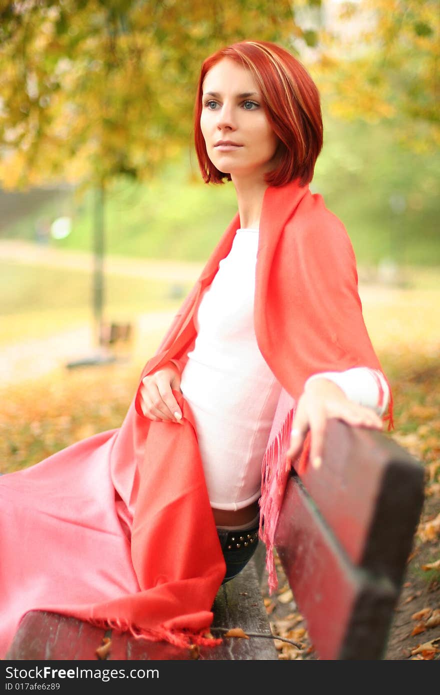 Young girl relaxing in autumn park. Young girl relaxing in autumn park