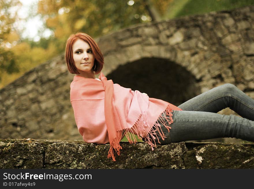 Young girl relaxing in autumn park. Young girl relaxing in autumn park