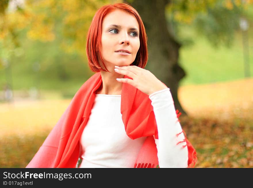 Young girl relaxing in autumn park