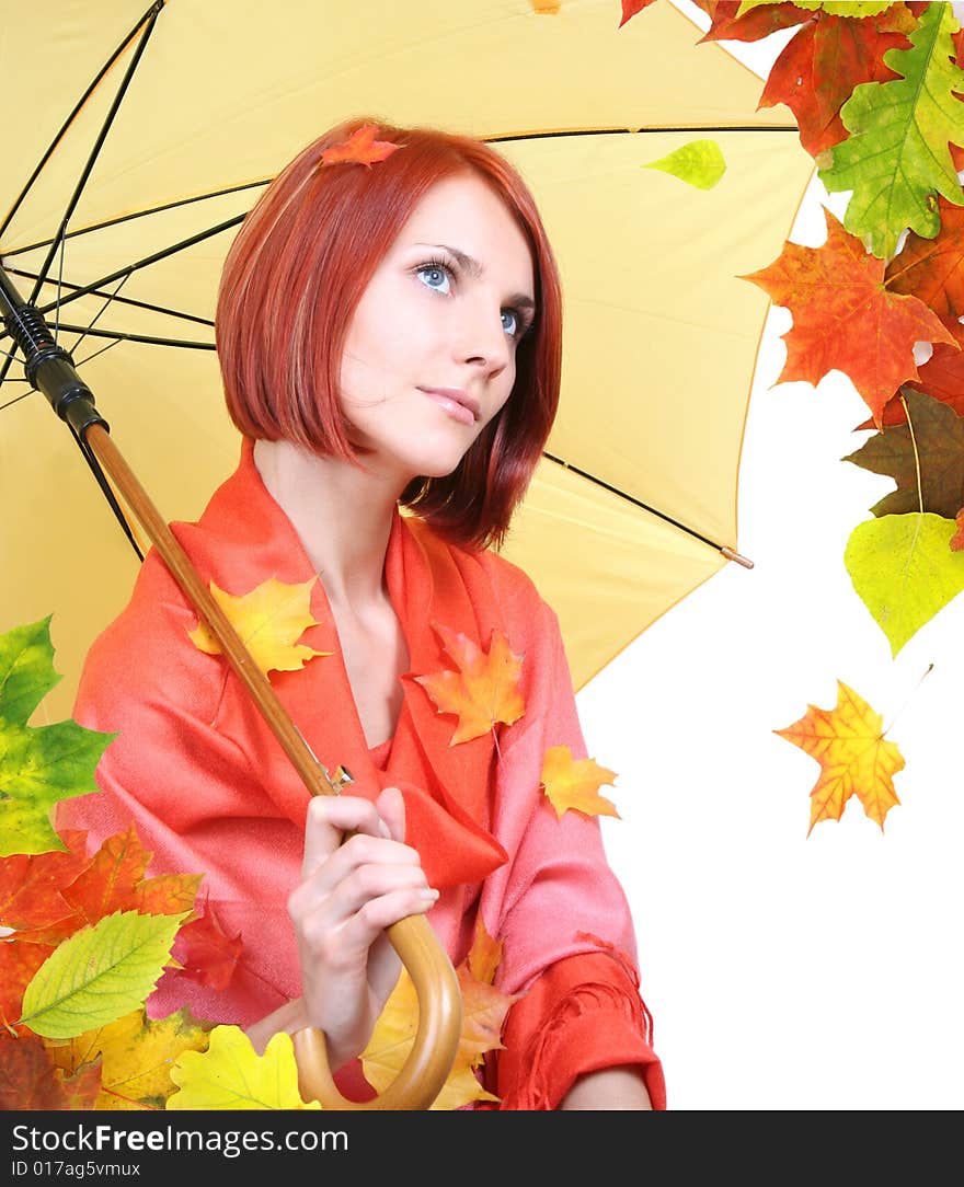 Beautiful girl with autumn leaves