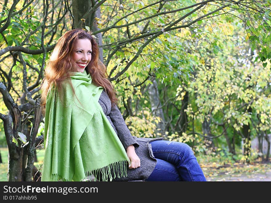 Young girl relaxing in autumn park. Young girl relaxing in autumn park