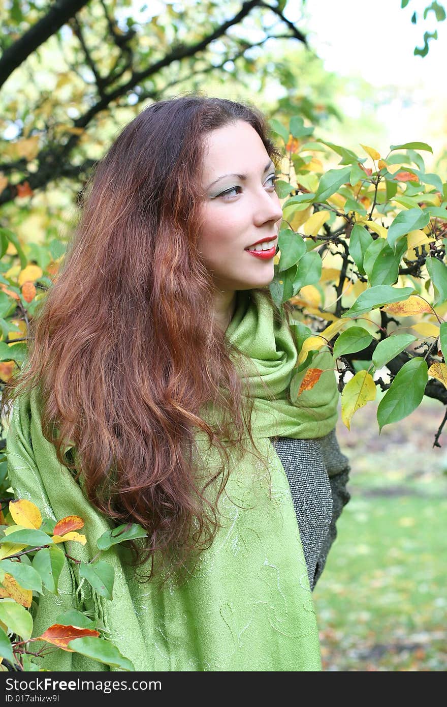 Young girl walking in autumn park. Young girl walking in autumn park