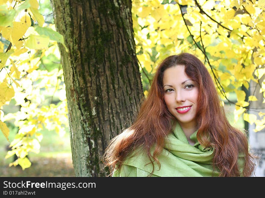 Young girl walking in autumn park. Young girl walking in autumn park