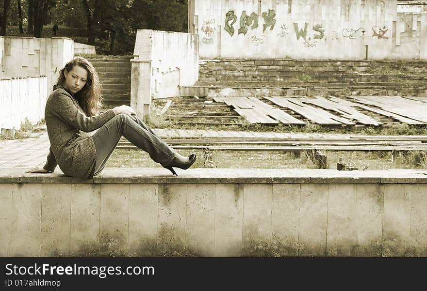 Lonely girl in autumn park. Lonely girl in autumn park