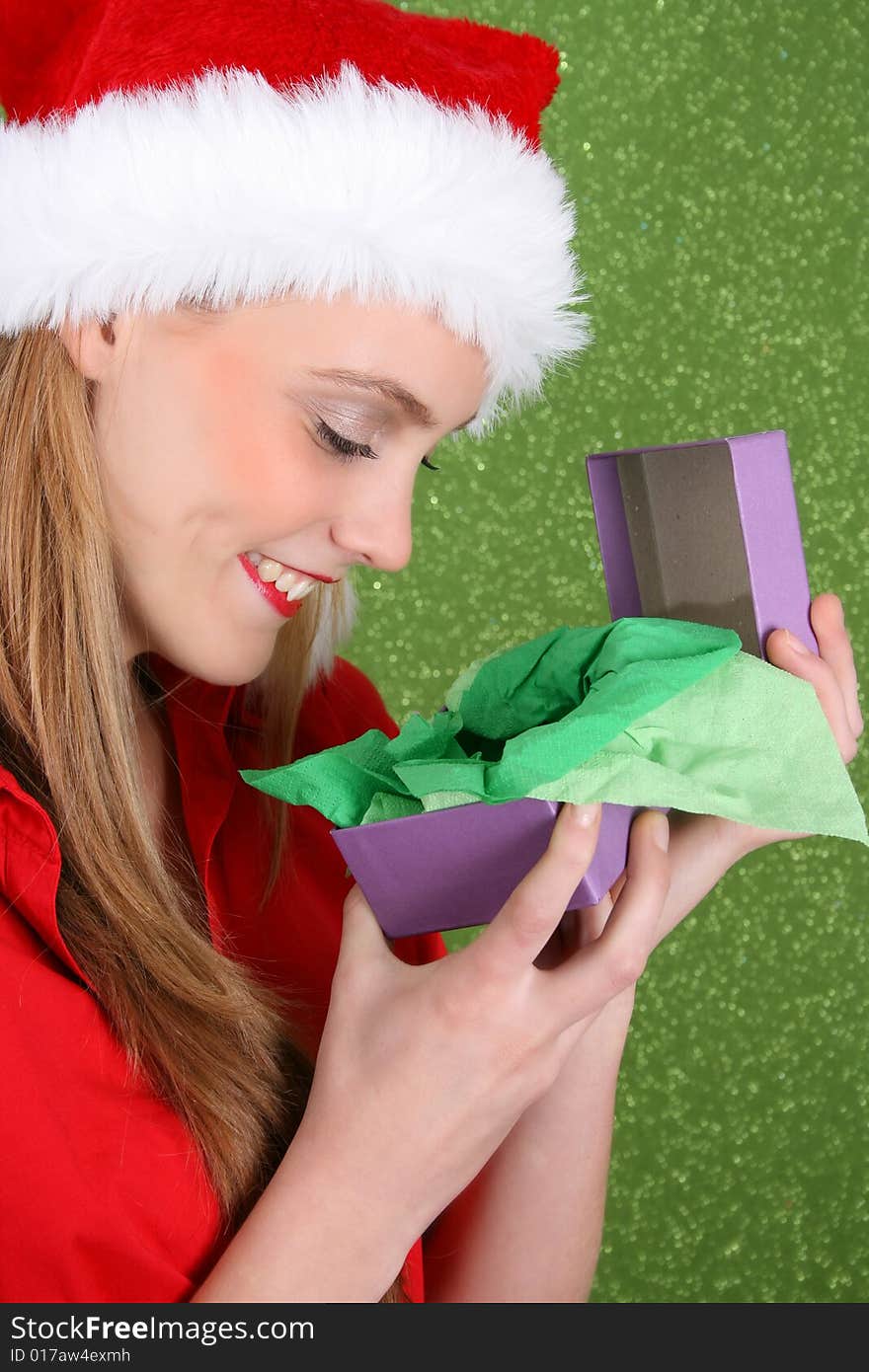 Beautiful teenager wearing a red shirt and christmas hat. Beautiful teenager wearing a red shirt and christmas hat