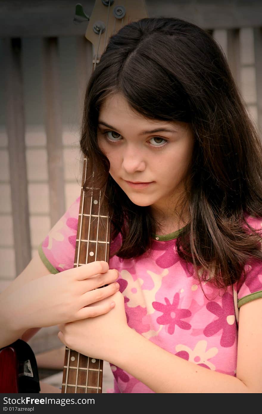 teen girl loving her guitar. teen girl loving her guitar